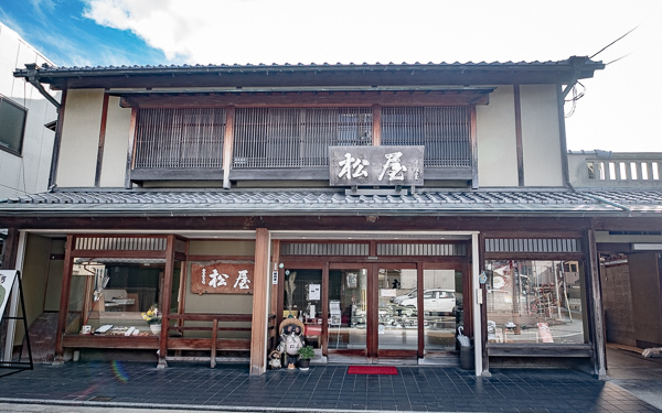 ま